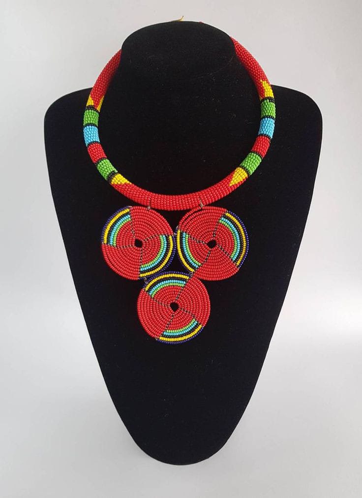 White pendant necklace; Red Zulu necklace