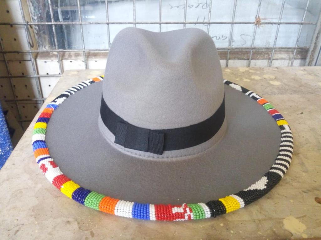 Blue Fedora hat decorated with colorful beads