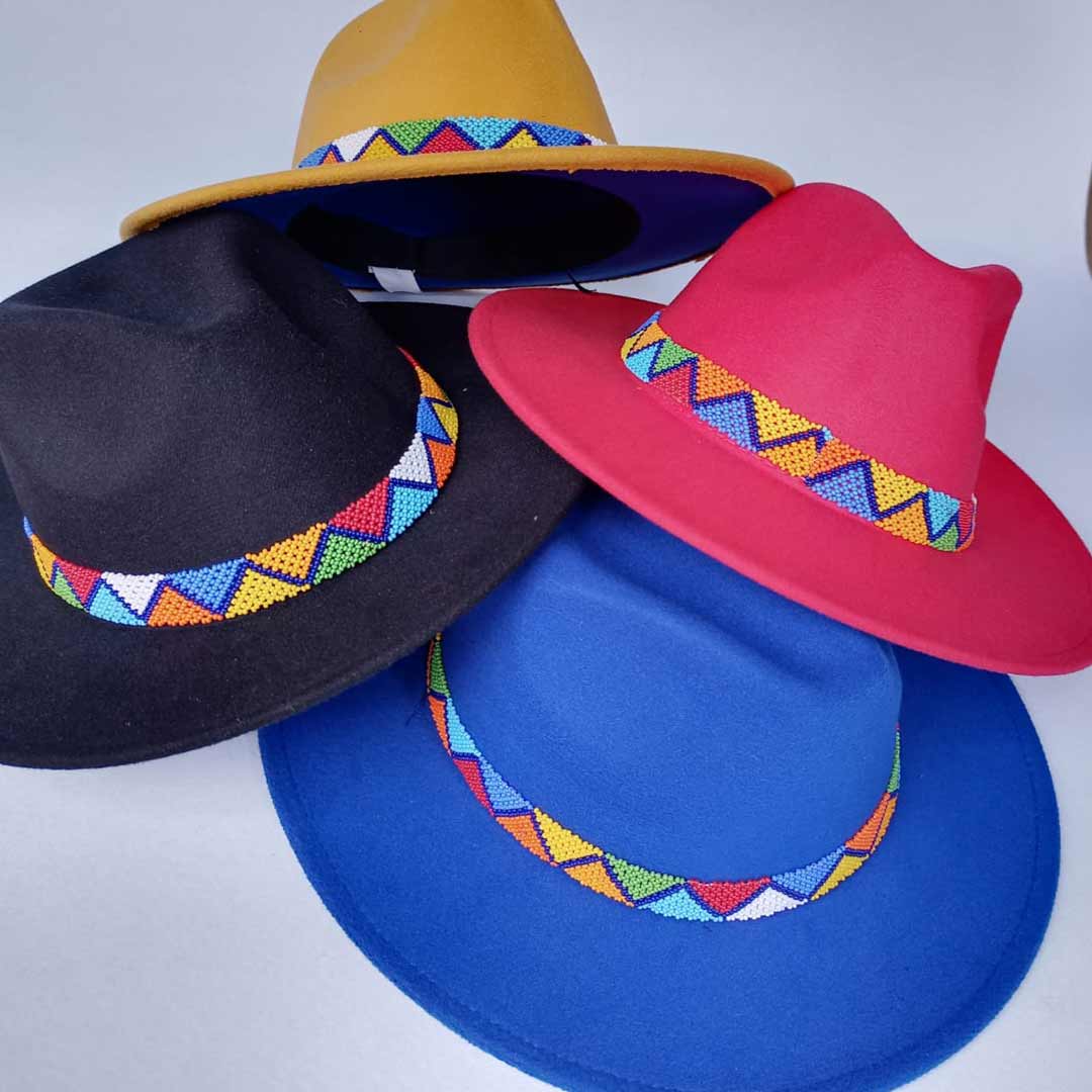 4 fedora hats decorated with colorful beads