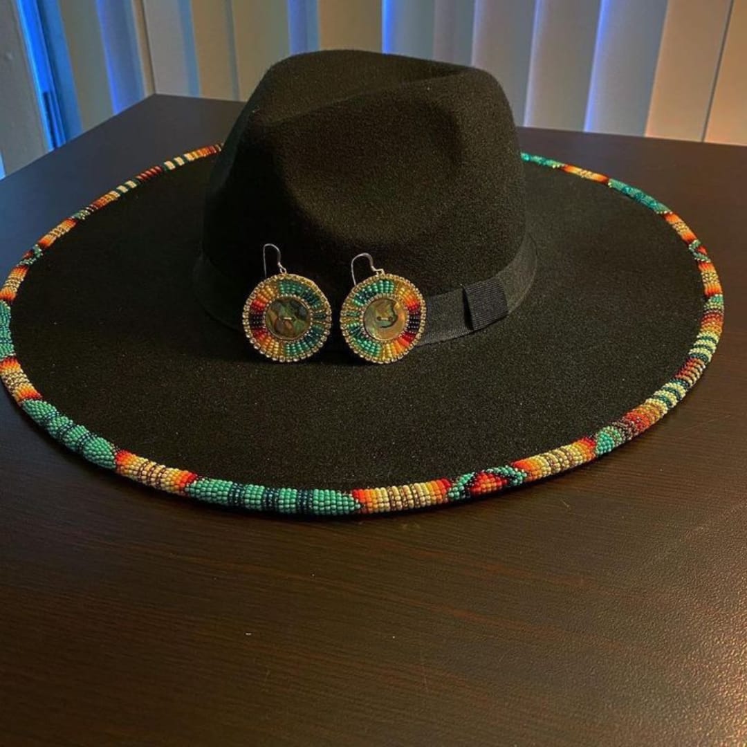 Classy black hat decorated with colorful beads and matching earrings